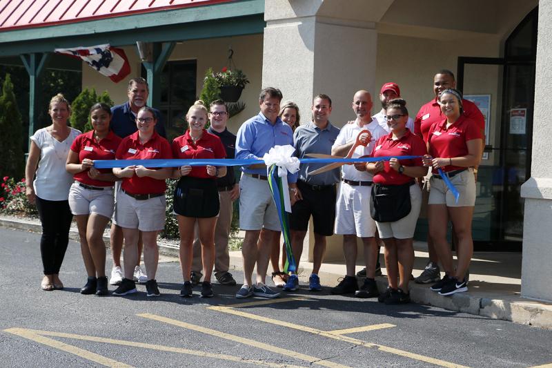 Grotto Pizza ribbon-cutting attendees shown are in back (l-r) Mike Daley, Thomas Cook, Christie DiNatale, Chase Milligan and Samuel Clark. In front are Lauren Weaver, chamber executive director; Monchelle Waters; Courtney Shertzer; Emily Patro; Jeff Gosnear; Vinnie DiNatale; Sean Golden; Jacqueline Holland; and Olivia Lemieux. SUBMITTED PHOTO